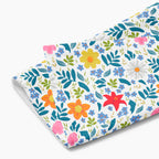 Cloth kitchen hand towel with white floral pattern on a white background