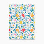 Hardcover journal with white floral patterned front cover design on a white background