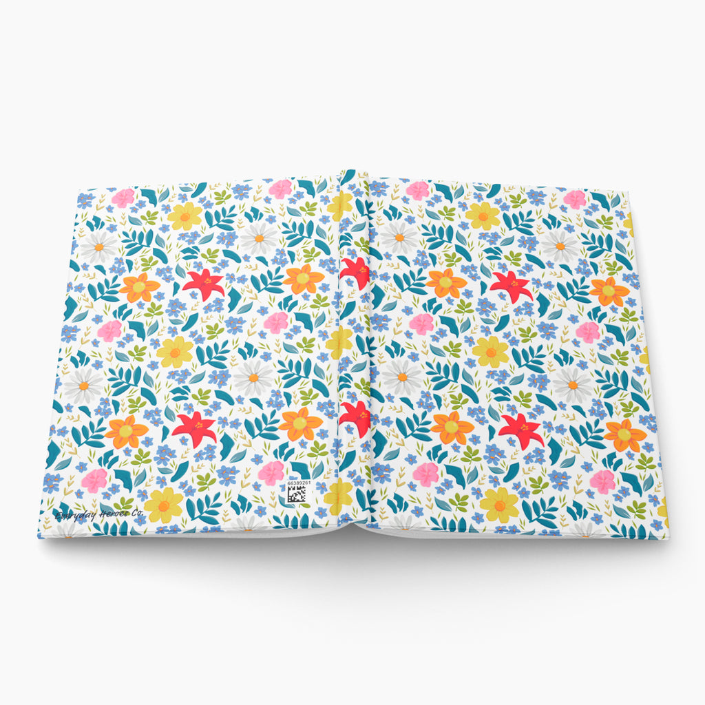Hardcover journal with white multi floral patterned cover design on a white background