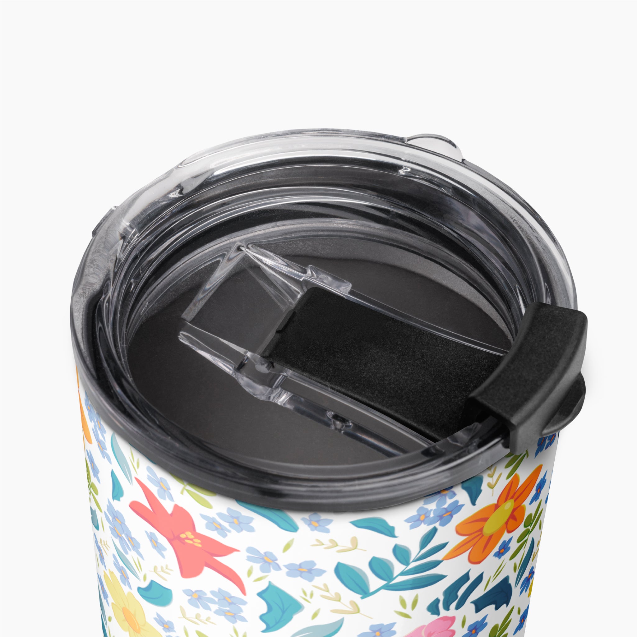 Tumbler with white floral pattern on a white background
