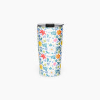 Tumbler with white floral pattern on a white background