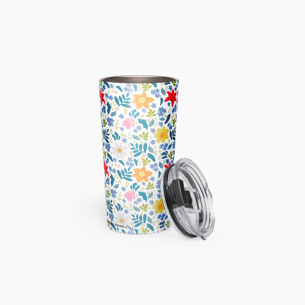 Tumbler with white floral pattern on a white background