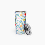 Tumbler with white floral pattern on a white background