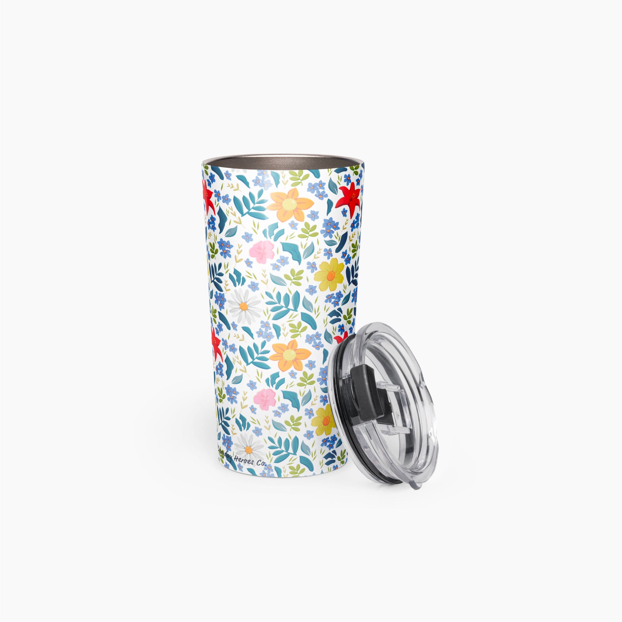 Tumbler with white floral pattern on a white background